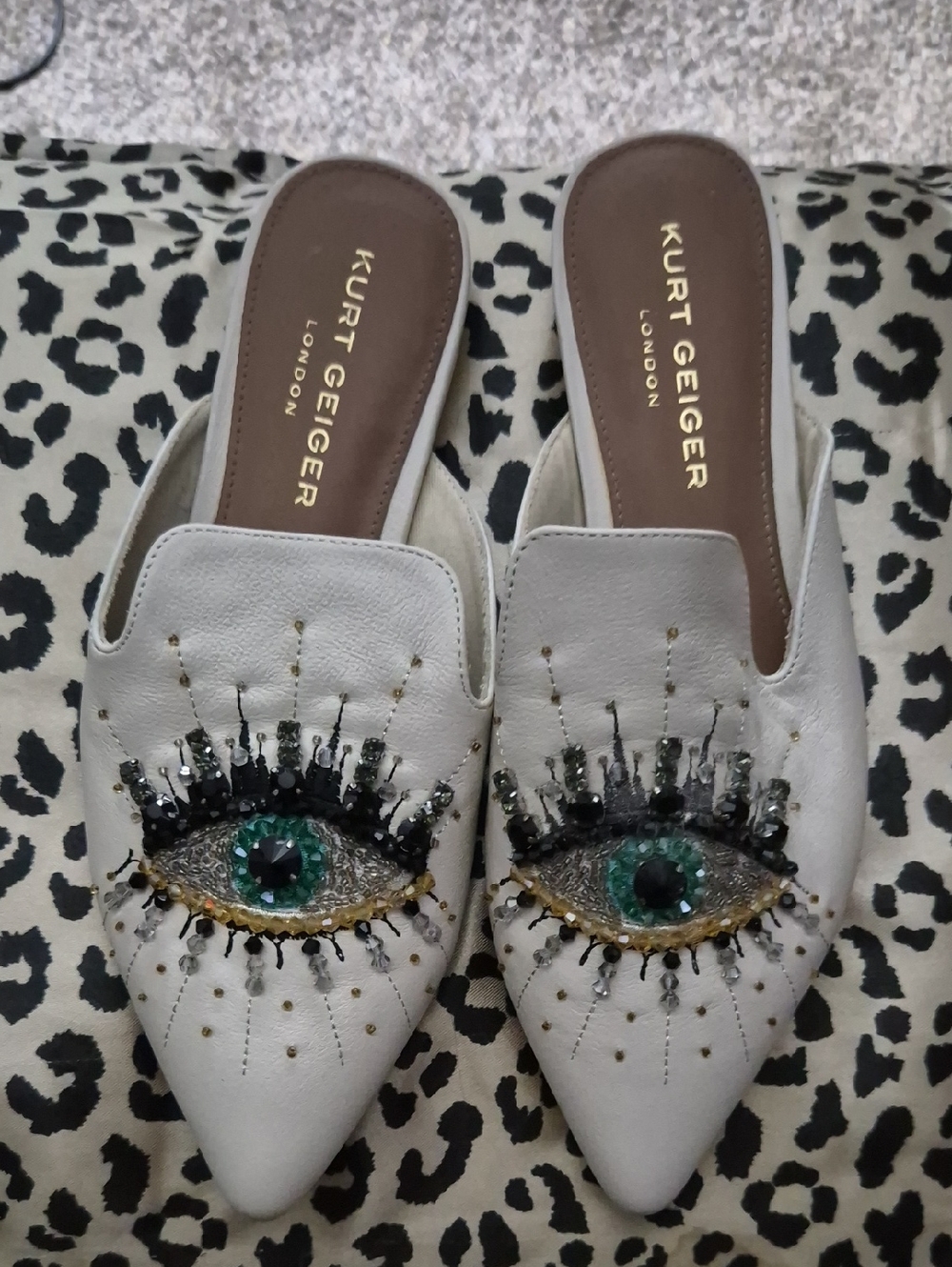 Kurt Geiger White Embellished Eye Mules with Green Gem Detail